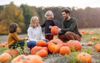 family at pumpkin patch