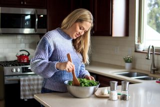 Woman making salad