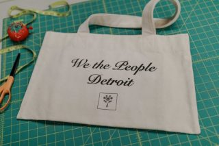 Canvas bag that says "we the people of Detroit."